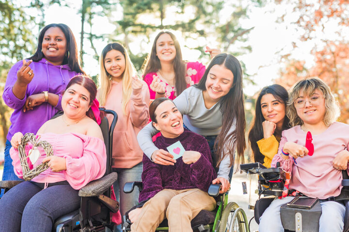 Women with cerebral palsy at park with friends
