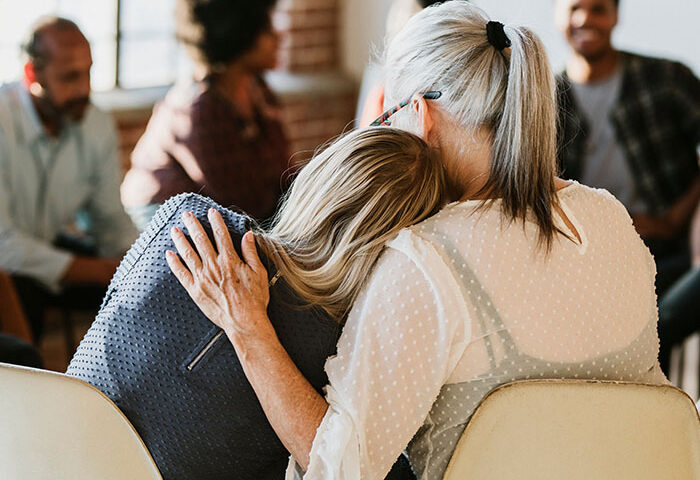 People support each other in a rehab session